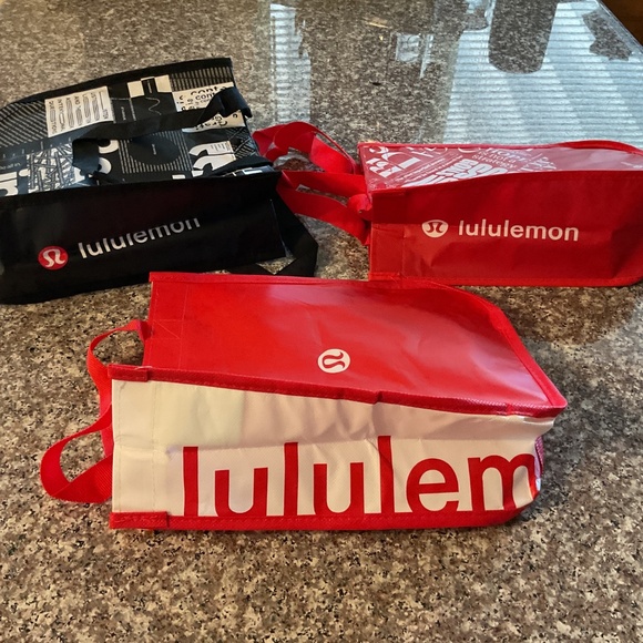 Lululemon Shopping Bags 2 Red 1 black. 12”x9”x4” Approximate measurements - Picture 2 of 2